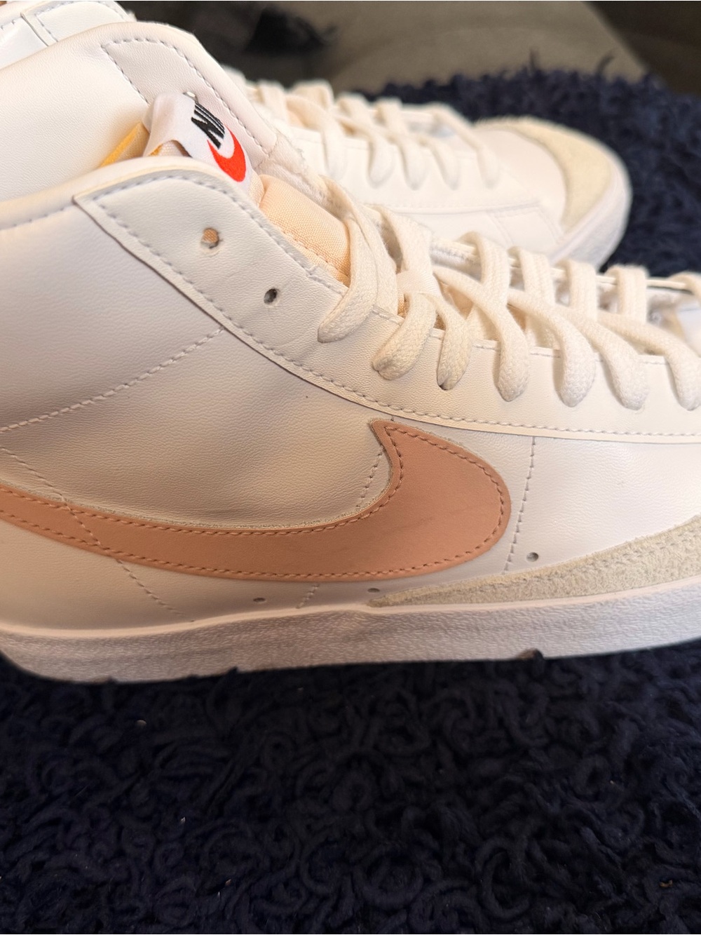 Nike Mid-Top Sneakers with White Upper and Peach Swoosh